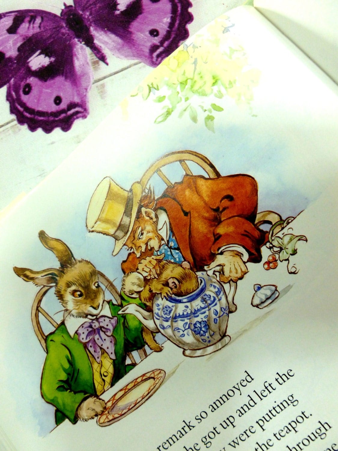 The Mad Hatter, Rabbit and Dormouse in a Teapot illustration from vintage Alice in Wonderland book by Rene Cloke. 
