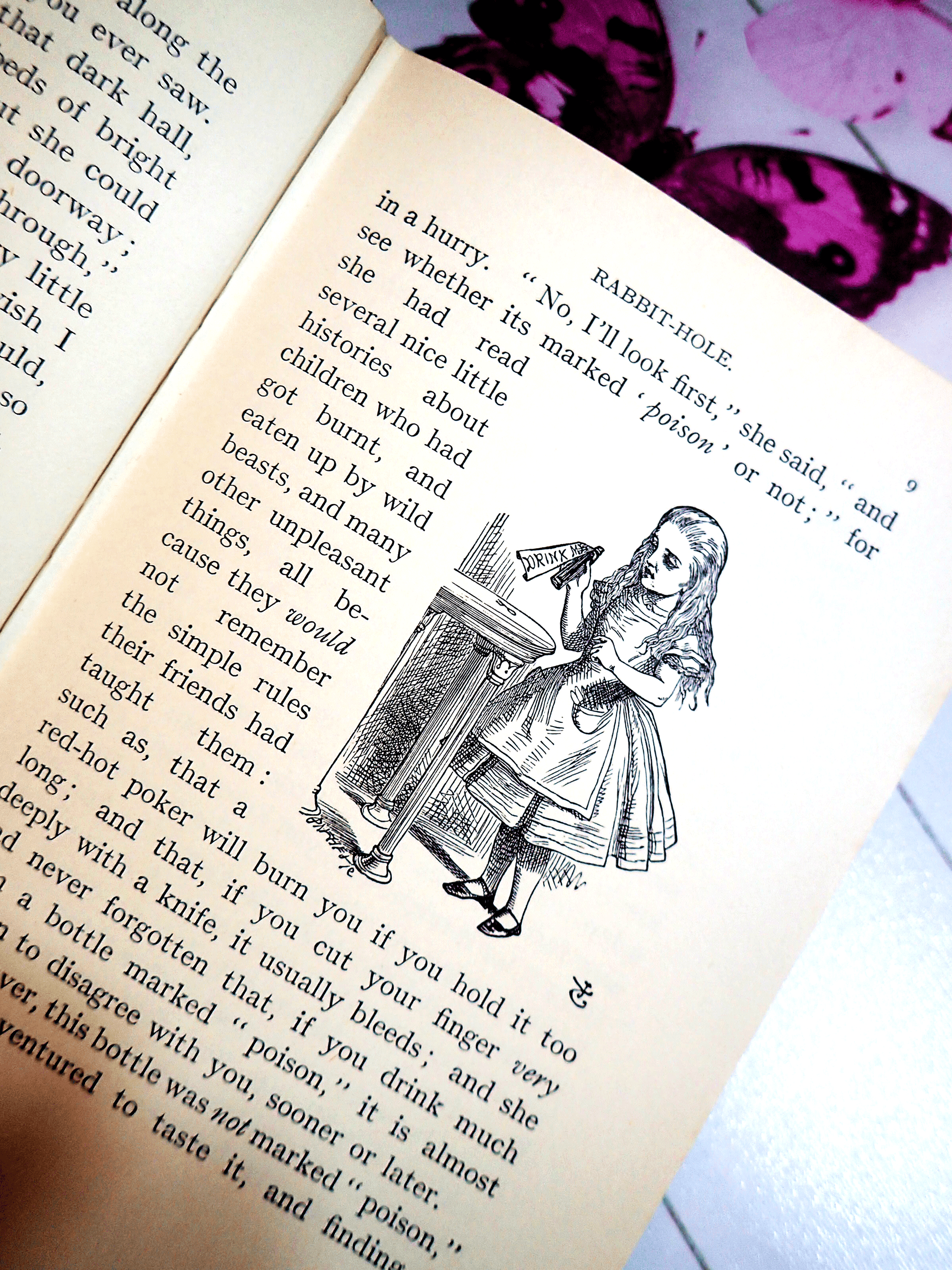 Page of Alice in Wonderland Lewis Carroll Warne Vintage Hardback Book showing Alice holding a bottle that says 'Drink Me'. 