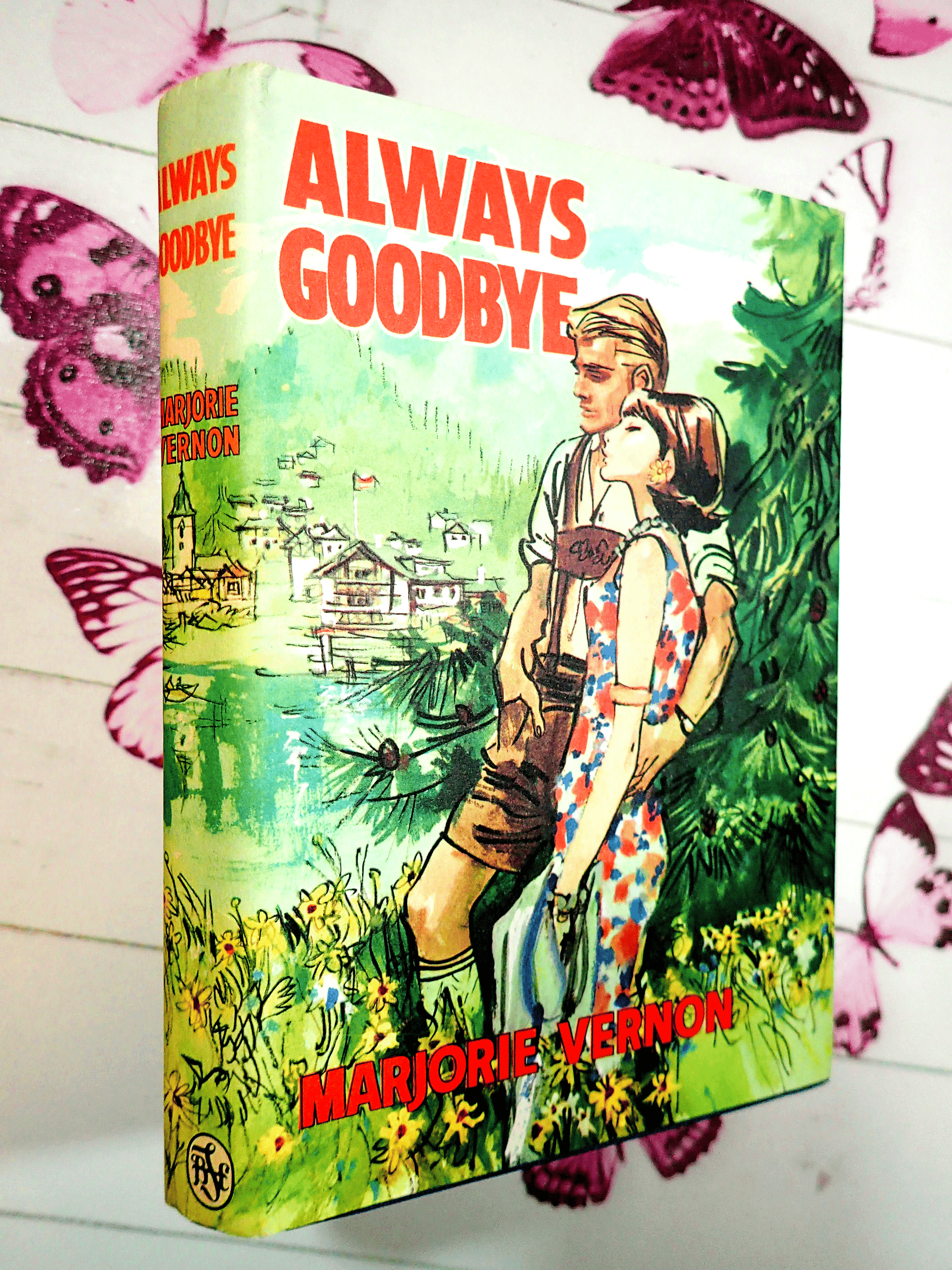 Front cover of Always Goodbye Marjorie Vernon Romance Book Club Hardback showing a handsome blonde Austrian man with a woman in 1960's dress. 