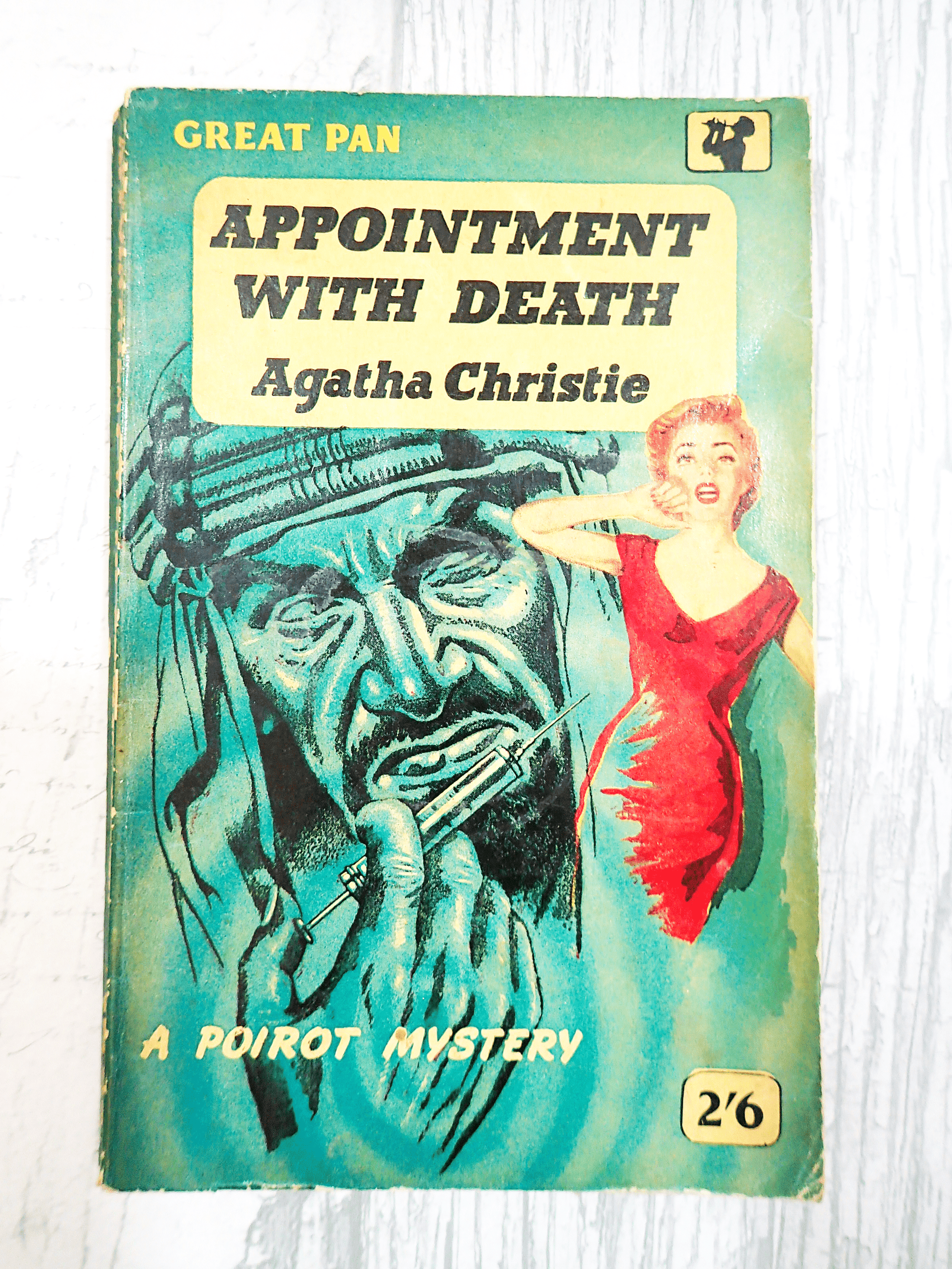 Front Cover of Appointment with Death Agatha Christie Great Pan Paperback Vintage Crime Book 1950's showing a distressed woman in Red with a giant image of a sheik with a syringe behind her against a light background.