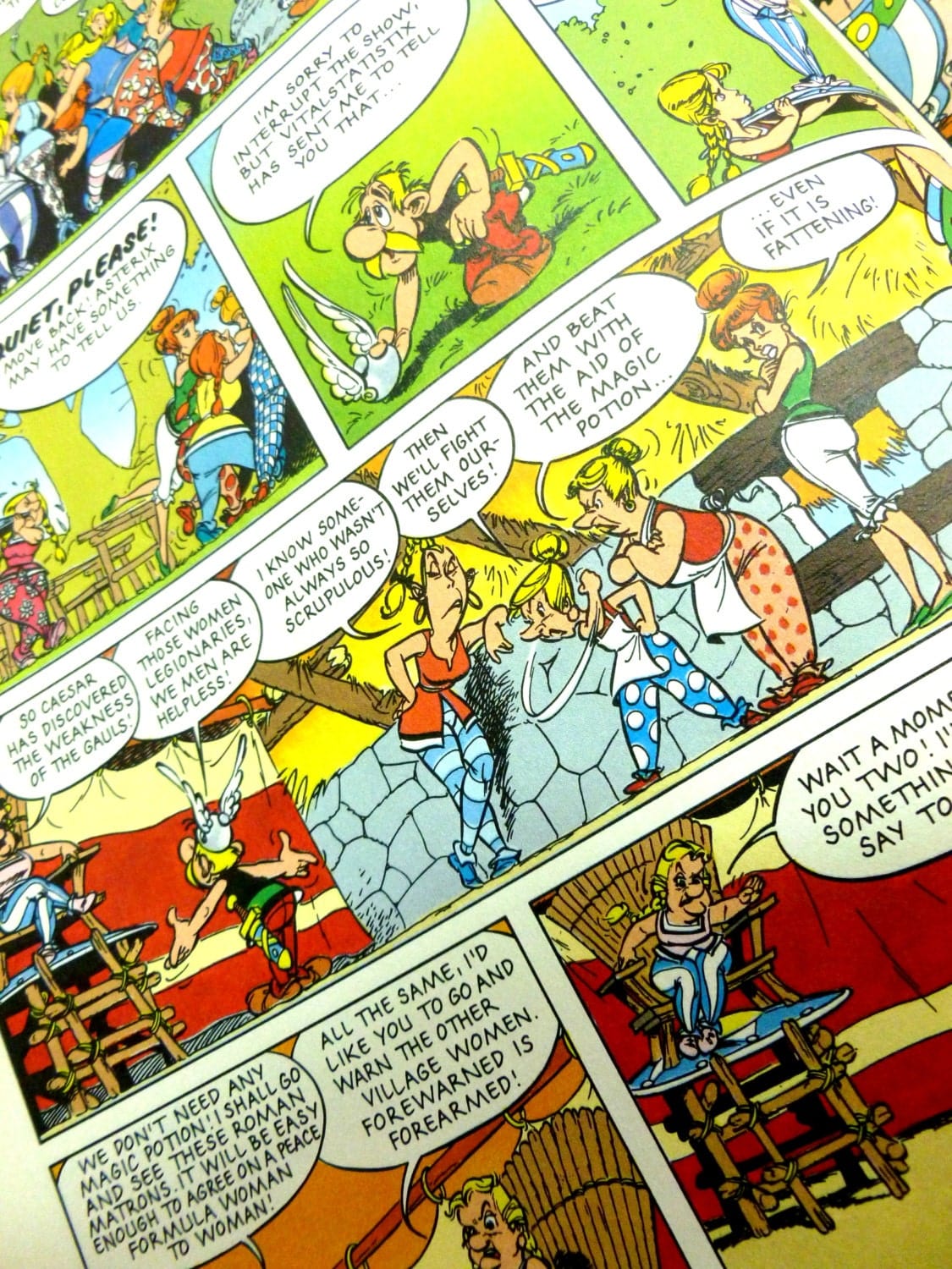 Cartoon page of Graphic Asterix novel showing Gaul women gossiping about Asterix.