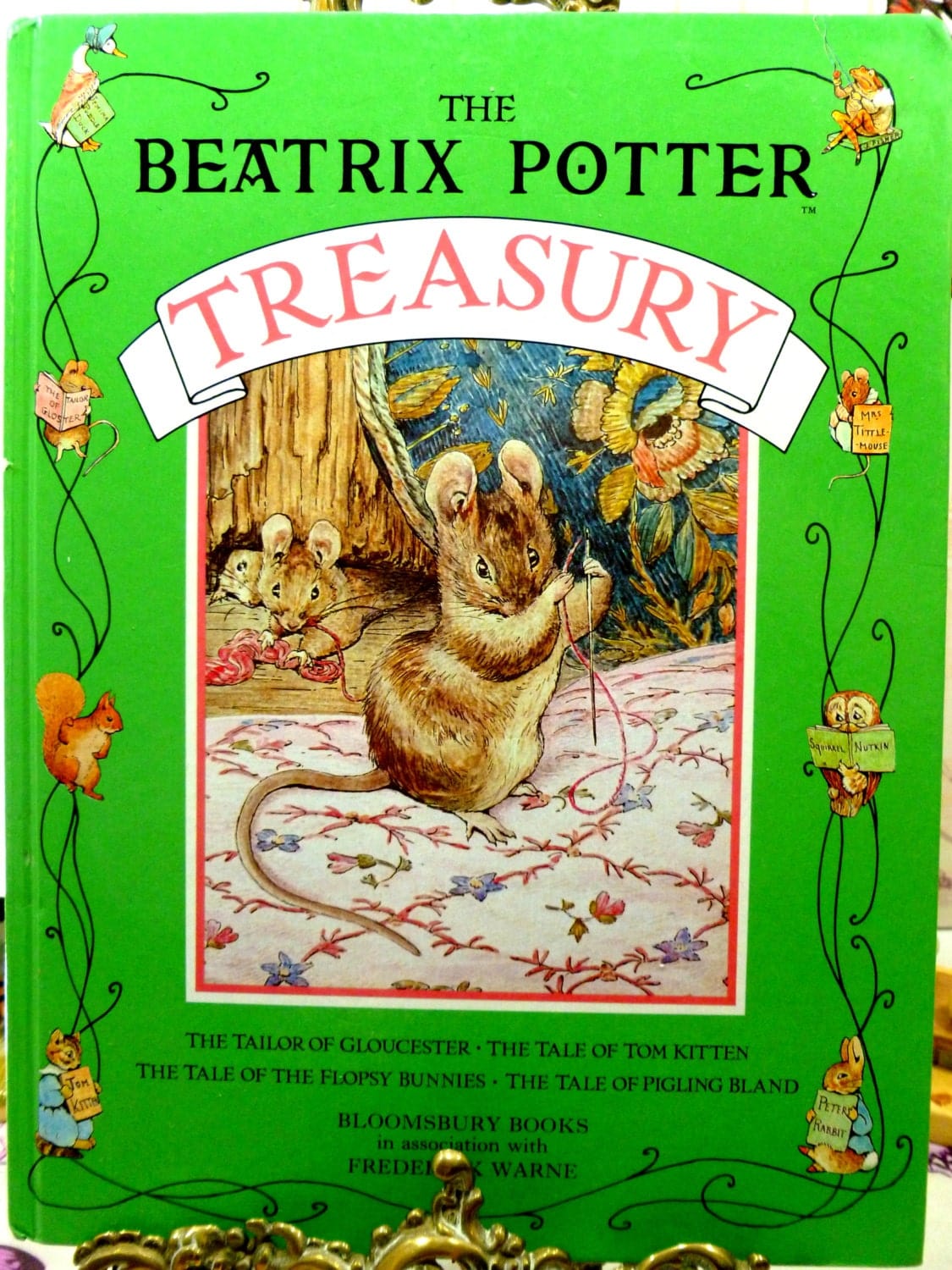 Front cover of The Beatrix Potter Treasury lovely vintage Childrens Book, Tailor of Gloucester etc. 1990's showing the mice from the story the Tailor of Gloucester against a green border and titles.