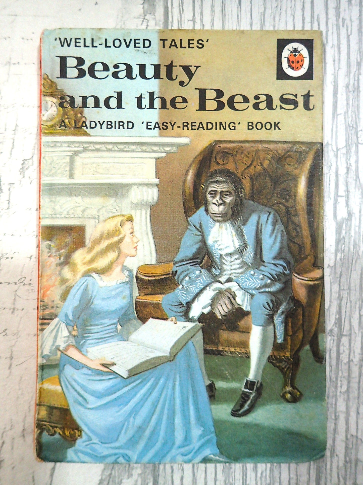 Cover of Beauty and the Beast Well Loved Tales LadyBird Vintage Children's Book Vera Southgate Showing Beauty Reading to the Beast, against a light background. 