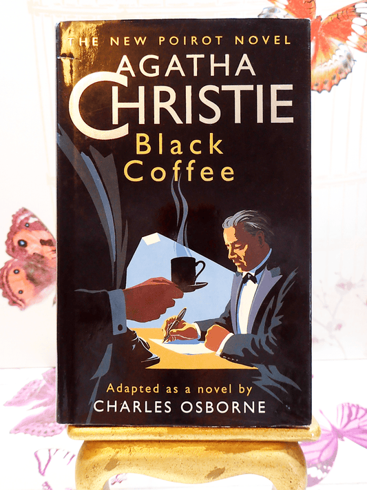 Cover of Agatha Christie Black Coffee Vintage Book Poirot Play Adapted by Charles Osborne with a stylish Art Deco design showing two men in tuxedos and one drinking coffee. 