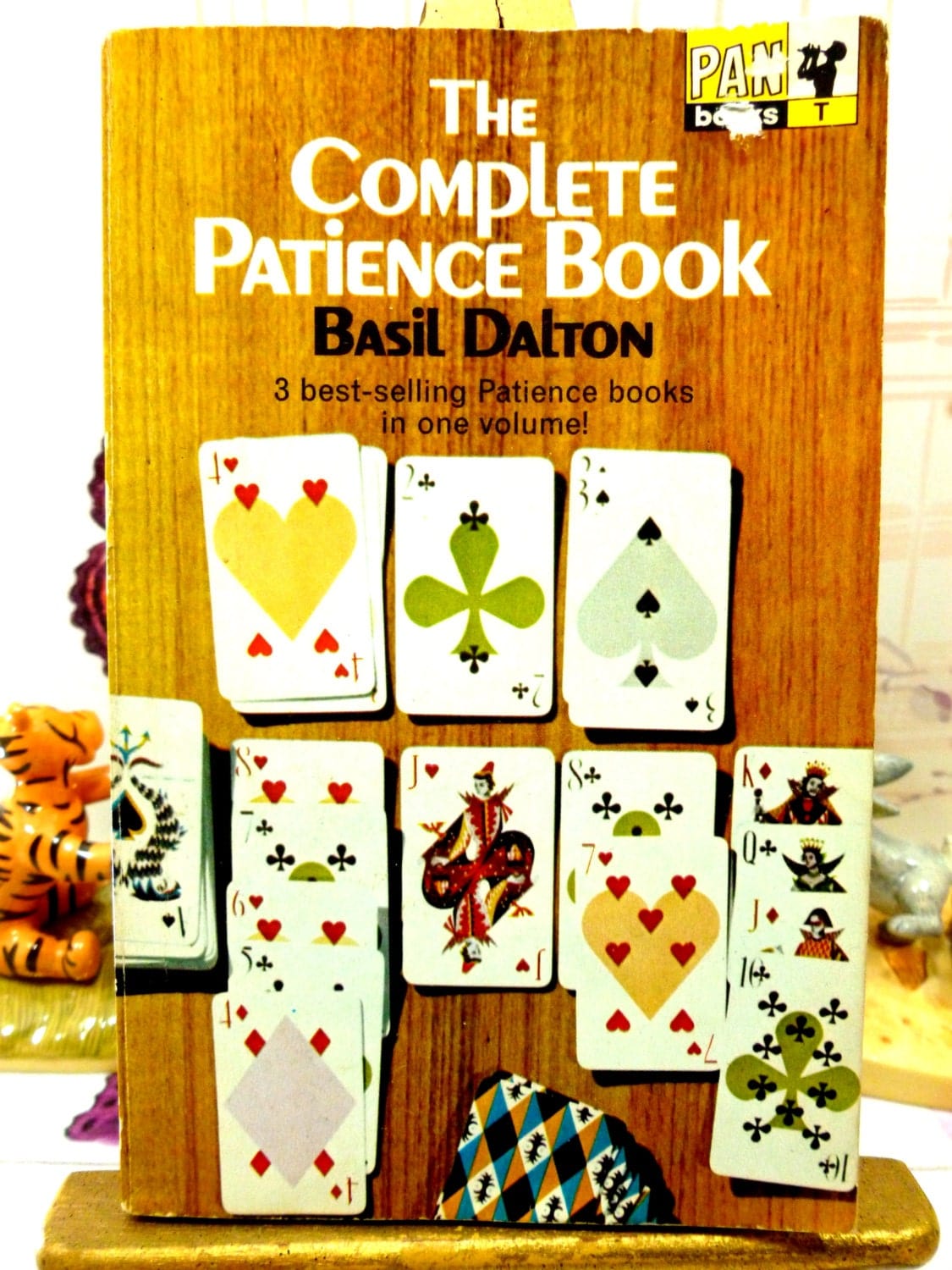 Front cover of The Complete Patience Book Basil Dalton 1960s Pan Paperback Book showing Pan logo and playing cards. 