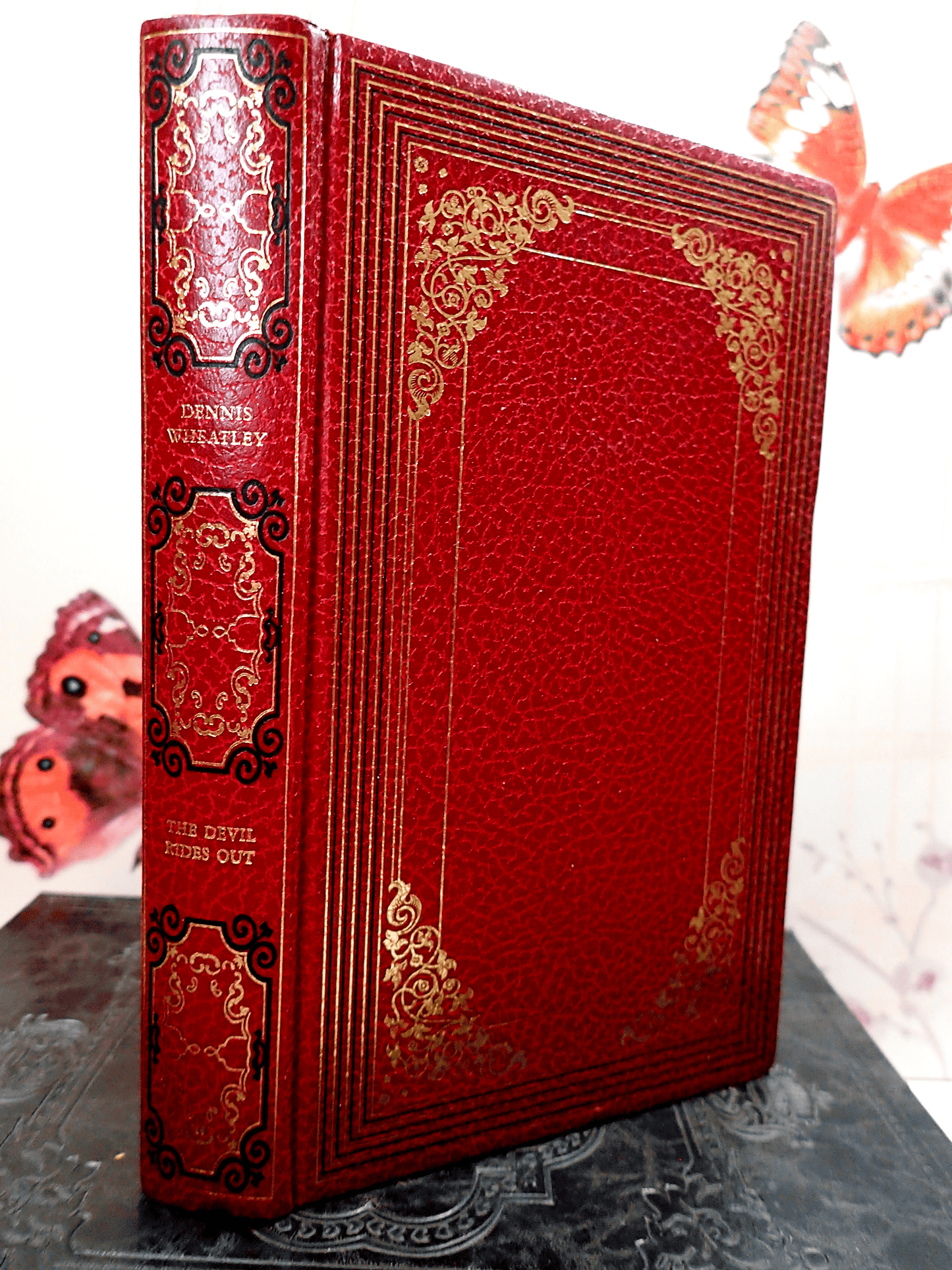 The Devil Rides Red, black and gilt decorated Dennis Wheatley with vegan Leather binding.