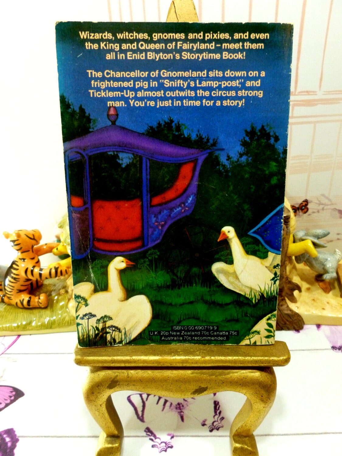 Back cover of Enid Blyton Storytime Book Vintage Paperback Armada 1970s showing white geese looking at a fairytale carriage. 