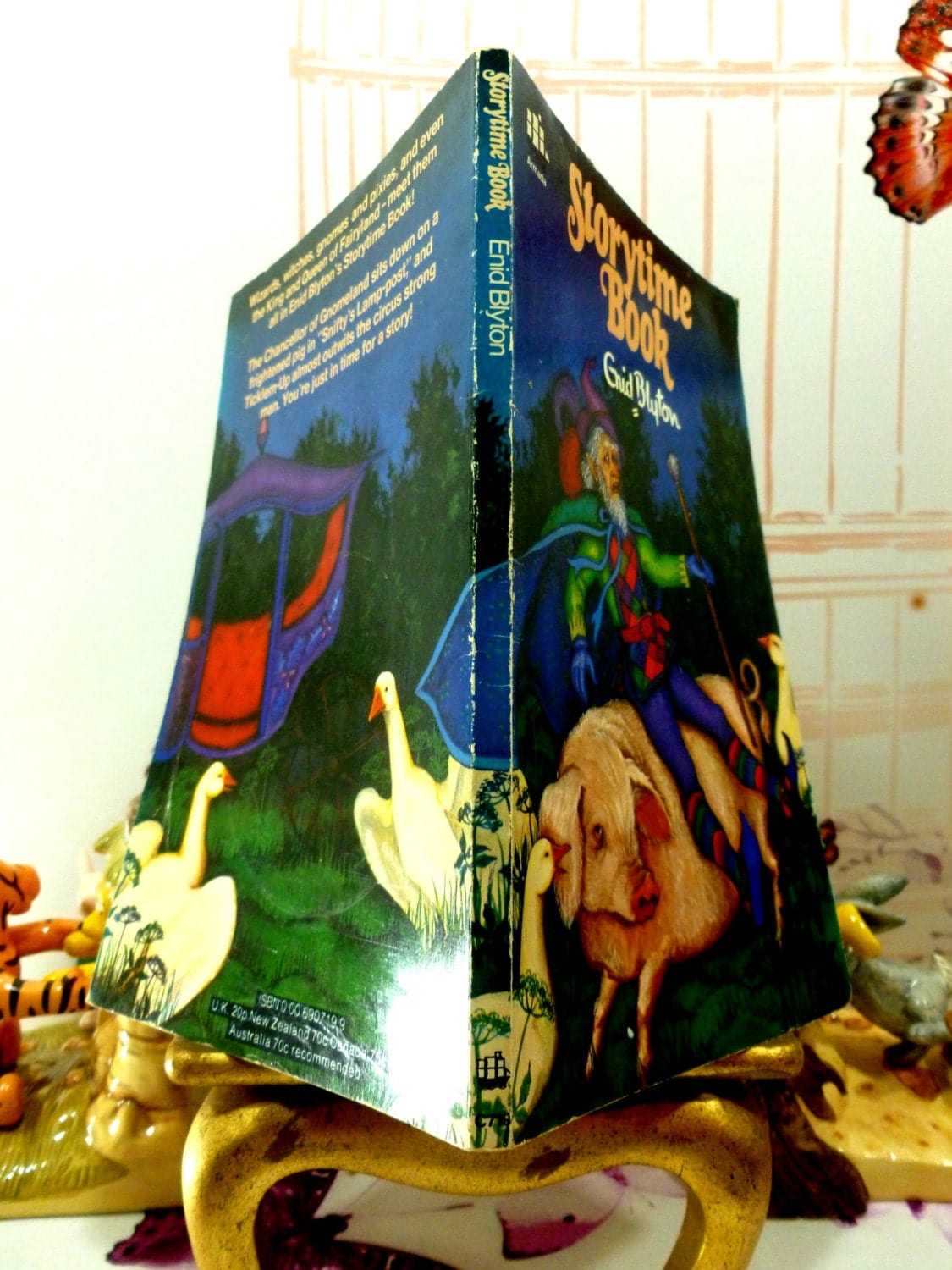 Back and front cover of Enid Blyton Storytime Book Vintage Paperback Armada 1970s showing white geese looking at a fairytale carriage and a gnome riding a pig. 