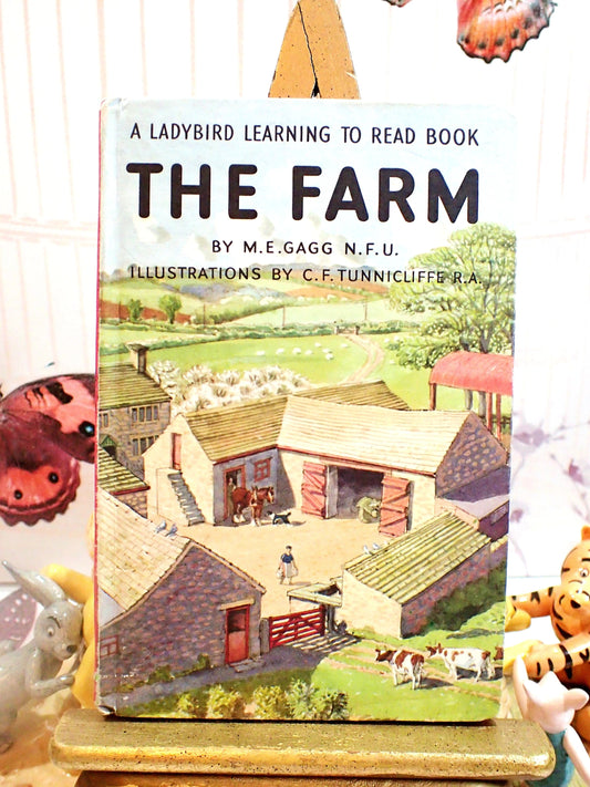 A Ladybird learning to read book, The Farm with images of Farm buildings. 