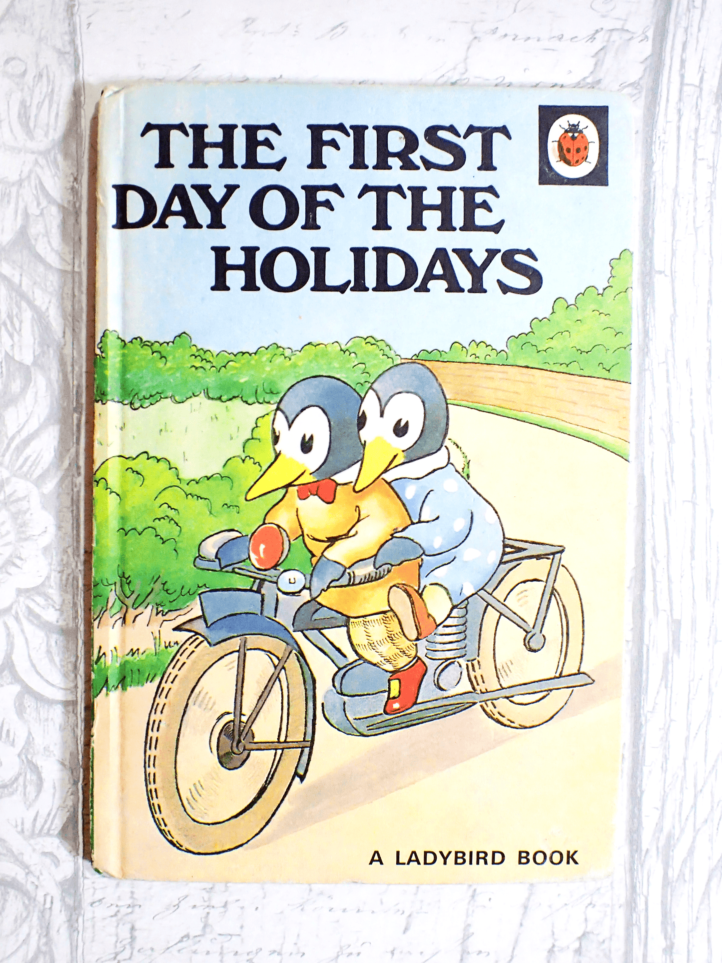 Vintage Ladybird Children's book featuring penguins against a pale grey background. 