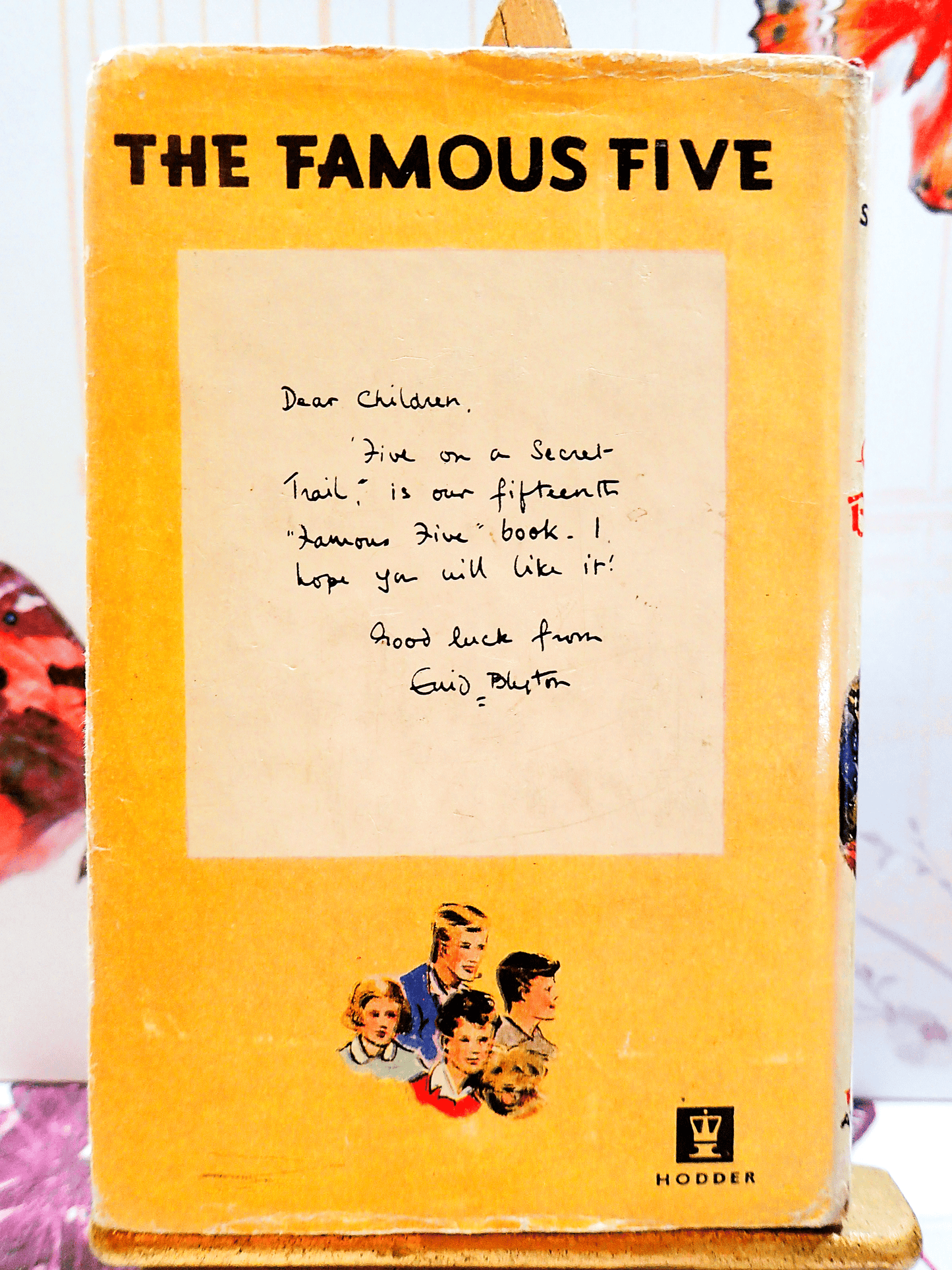 Back cover of Five on a Secret Trail Enid Blyton First Edition 1956 showing Julian, Ann, Dick, George and Timmy the Dog with a note from Enid Blyton: 'Dear Children...'