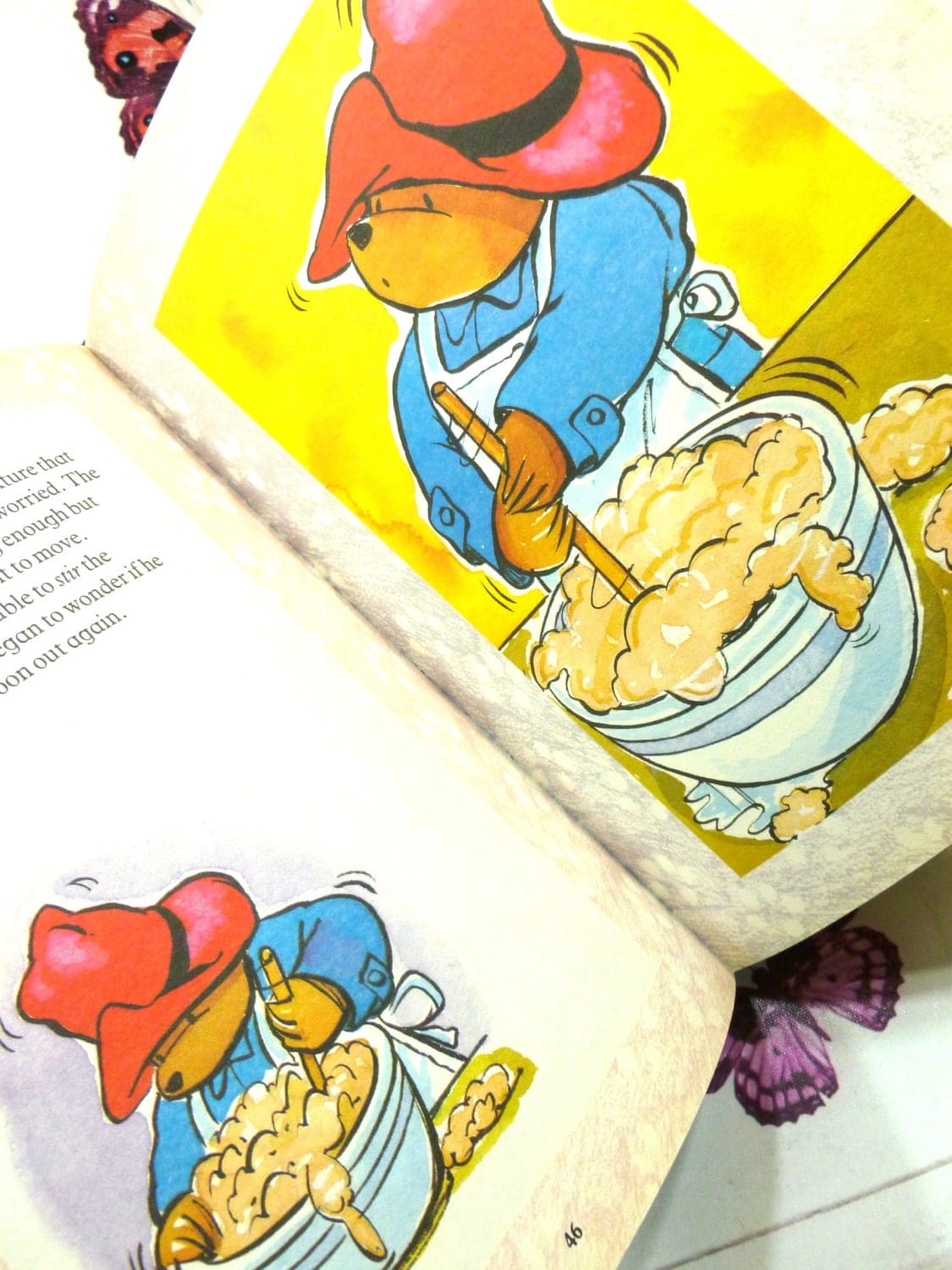 Page of The Giant Paddington Story Book by Michael Bond Paddington Bear First Ed. 1989 Showing Paddington stirring a baking bowl. 