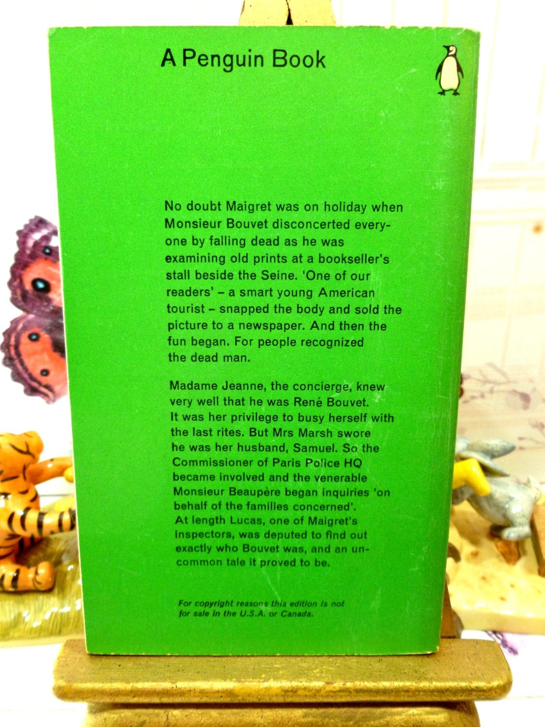 Back cover of Vintage Penguin Paperback book Inspector Maigret Inquest on Bouvet by Georges Simenon Crime Fiction with blurb on green ground with Penguin logo. 