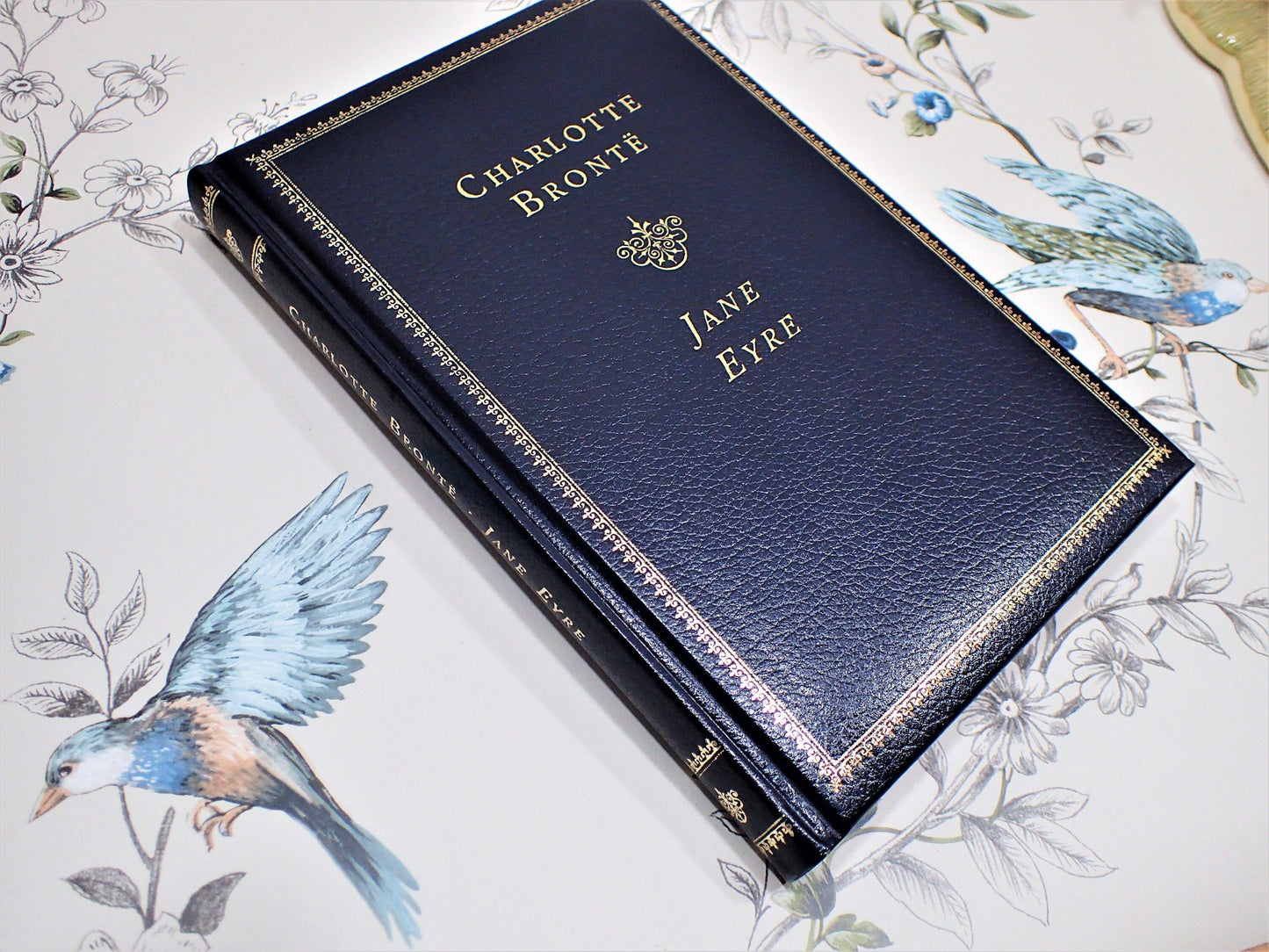 Spine and Front cover of Charlotte Bronte Book in Midnight Blue Faux Leather with Gilt Titles, Marbled endpapers and Gilt Edged Pages