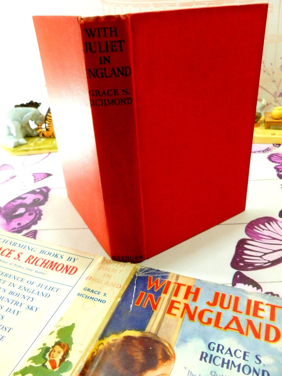 Red clothbound boards with black titles to the spine of With Juliet in England by Grace S Richmond Scarce Vintage 1930s Romance Novel.