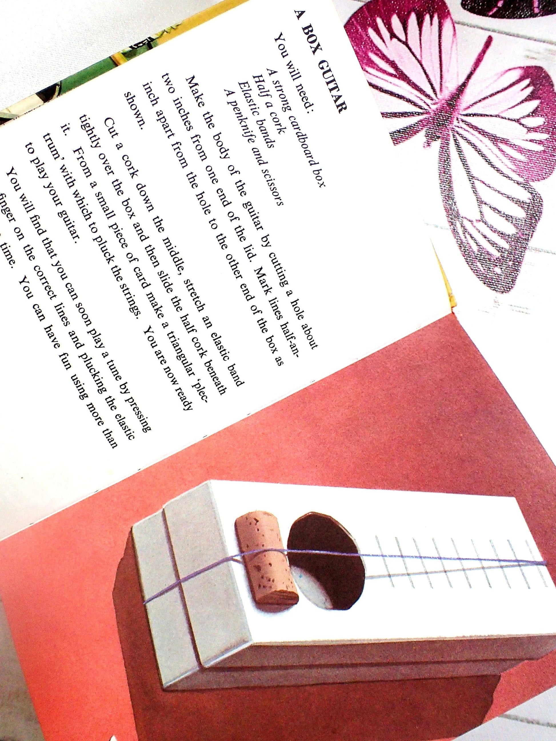 A box guitar cork and string ladybird book