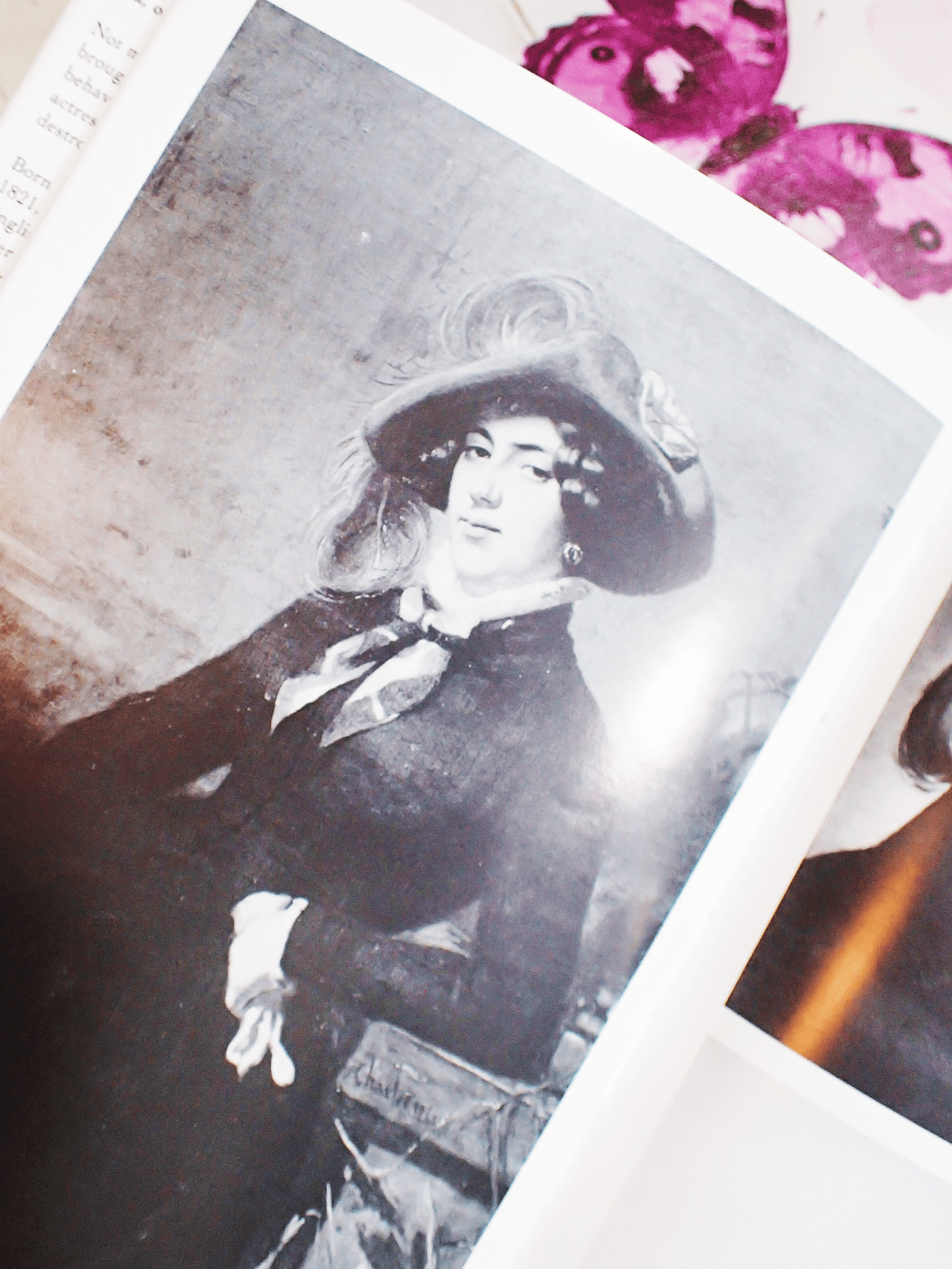 Pages from Lola Montez Her Life & Conquests by James Morton showing a grayscale portrait of Lola Montez looking coquettish. 