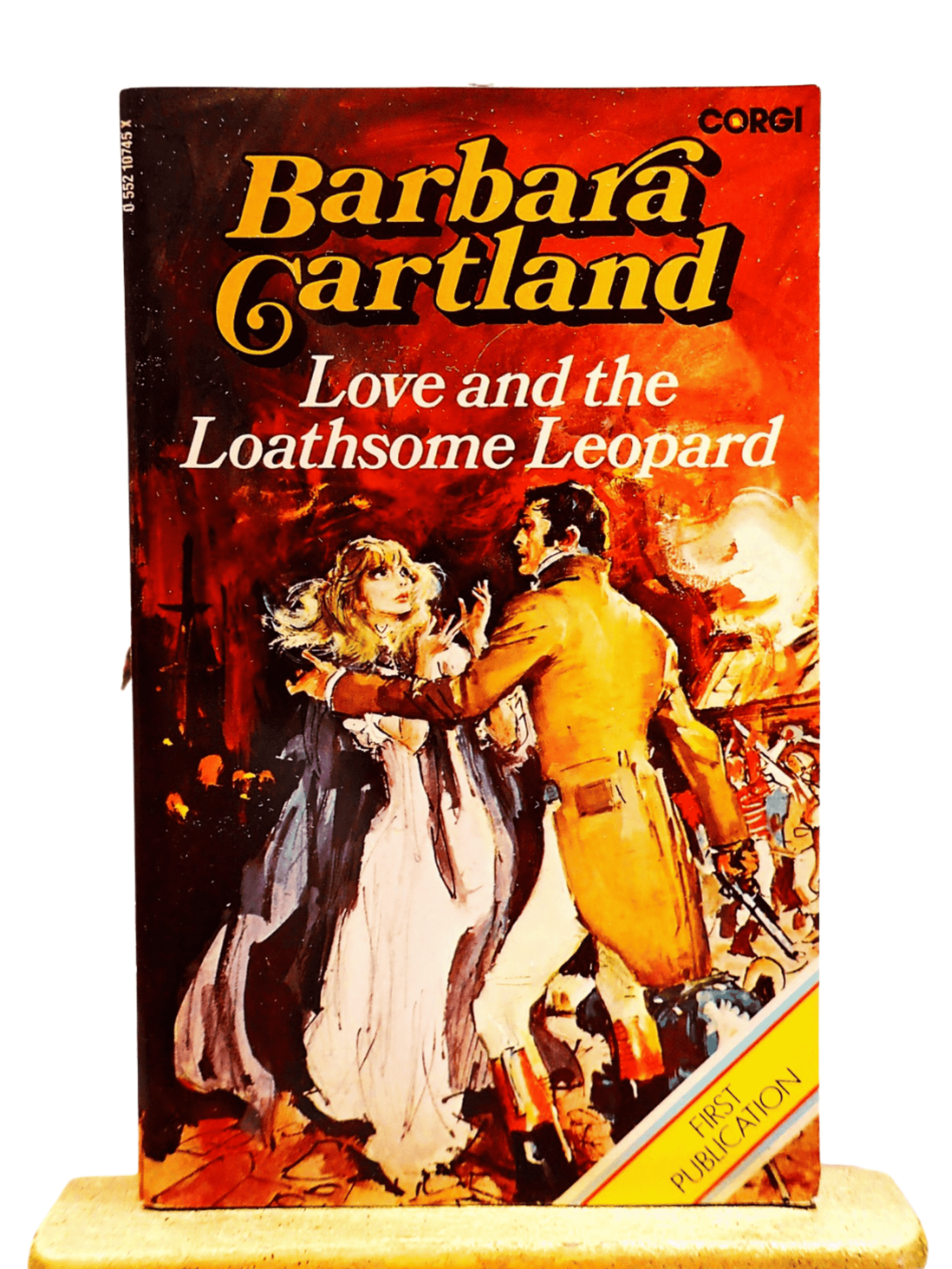 Front cover of Love and the Loathsome Leopard Barbara Cartland Corgi paperback showing a frightened woman in a cape being rescued by a handsome man. 
