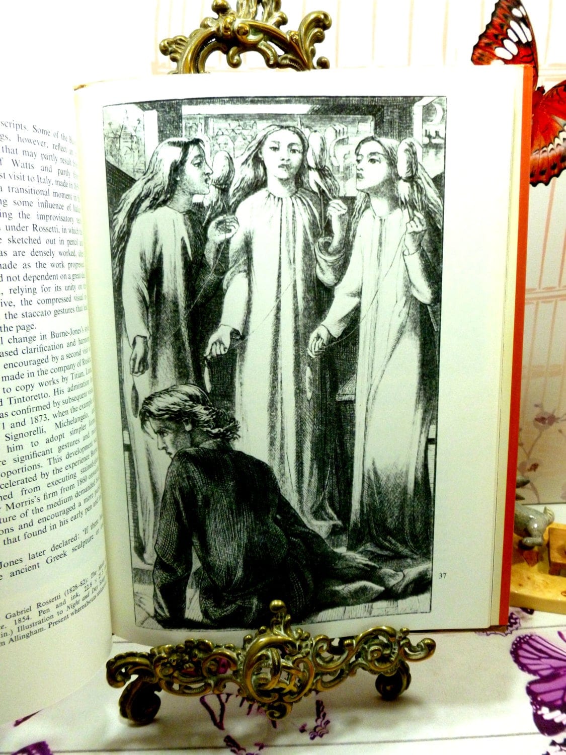 Pages from Magnificent Dreams vintage hardback book about Burne Jones and The Victorian Pre Raphaelites showing a grayscale image of a pre-raphaelite painting. 