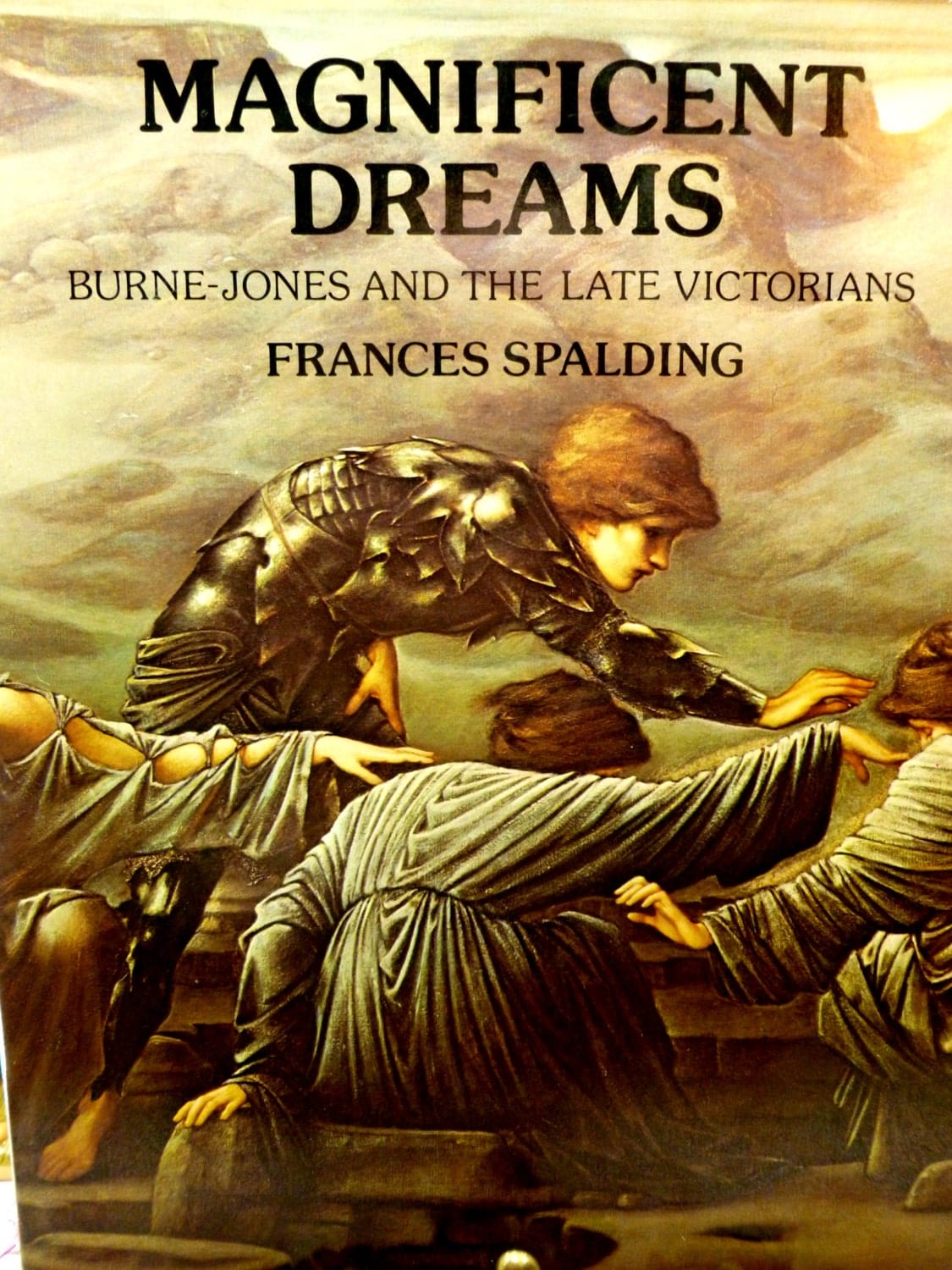 Front cover of Magnificent Dreams vintage hardback book about Burne Jones and The Victorian Pre Raphaelites showing a vignette from a pre-raphaelite painting. 