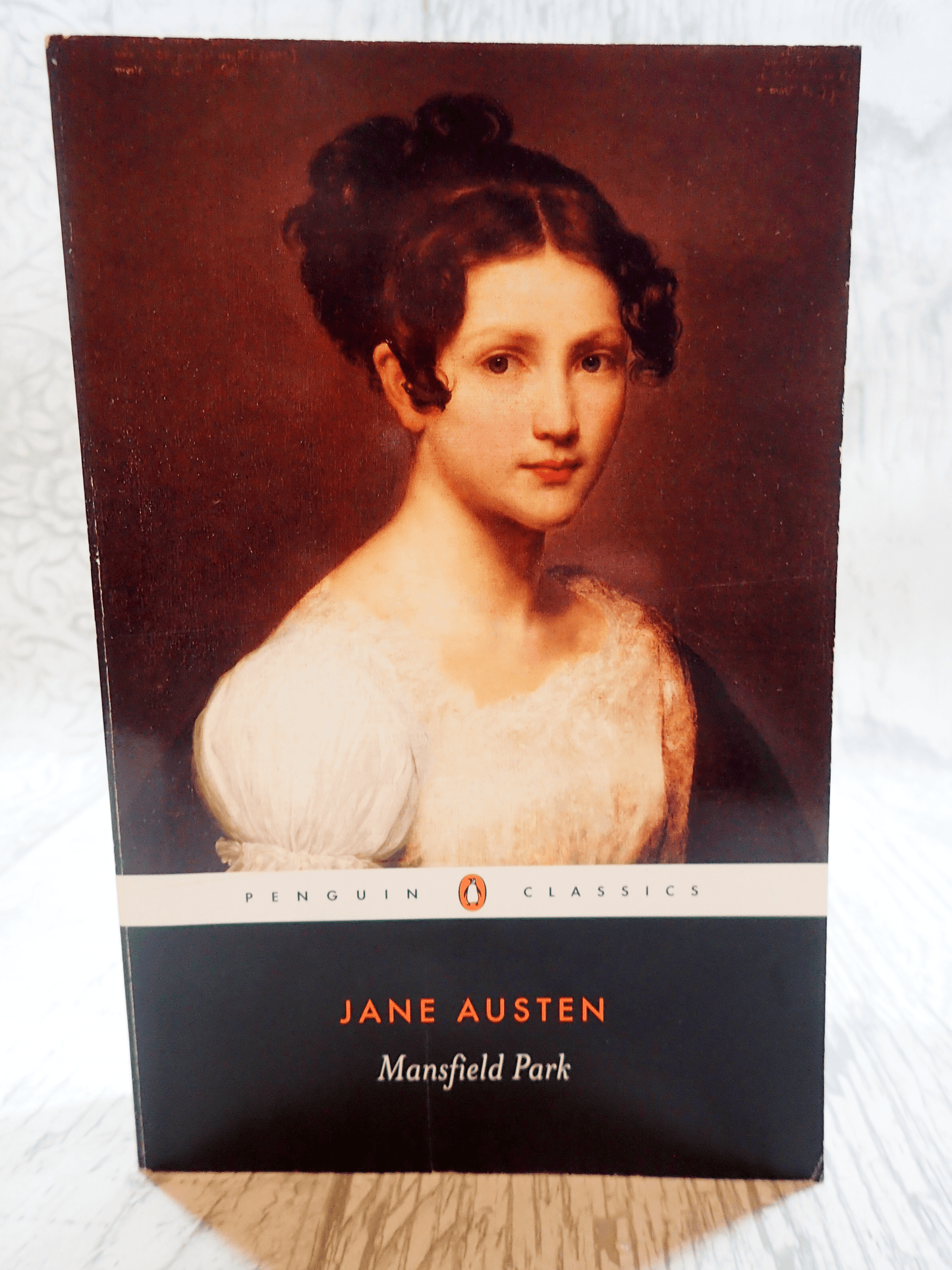 Front cover of Mansfield Park Jane Austen Penguin Classics showing a portrait of a Regency Girl against a light background. 