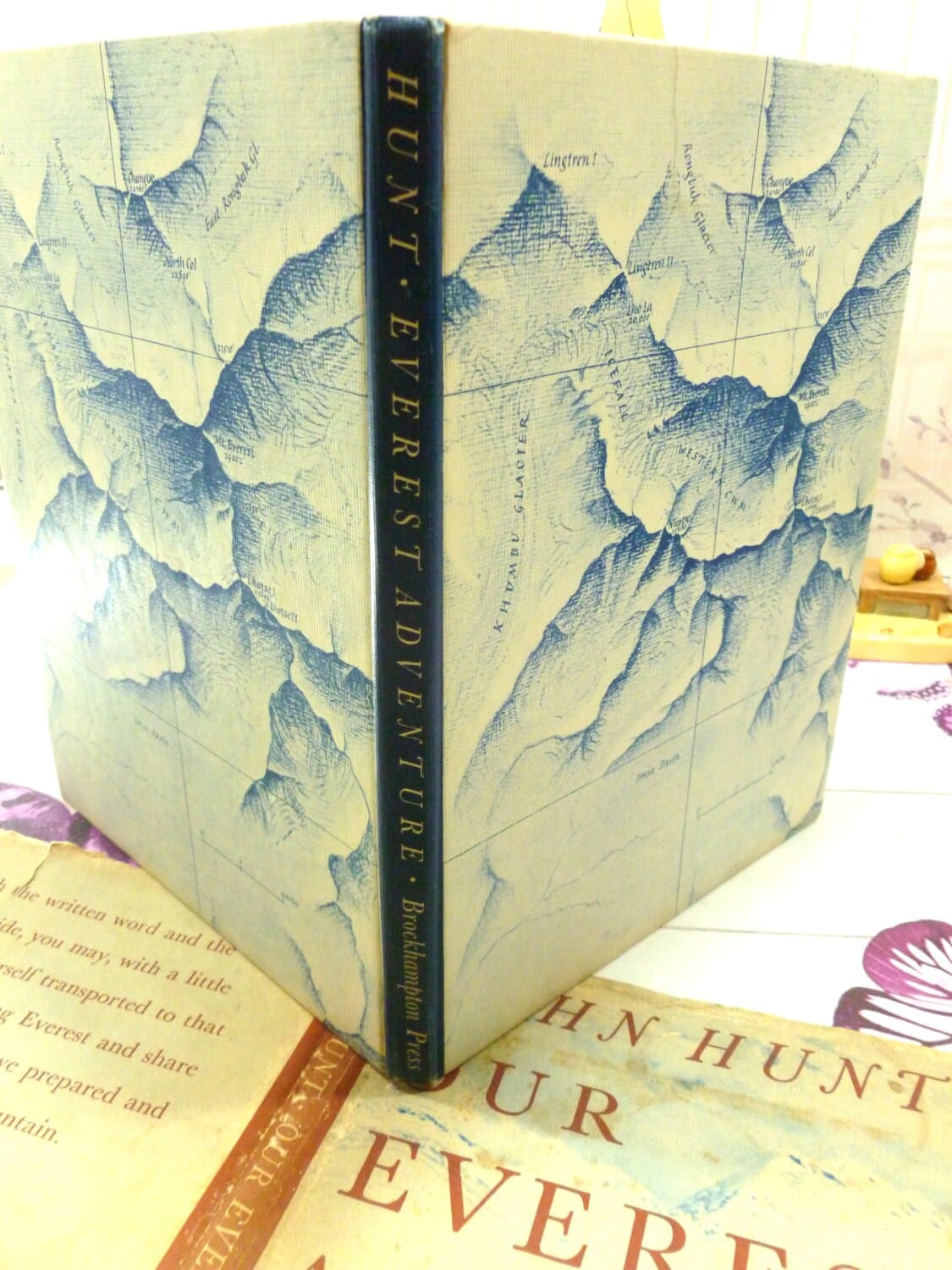 Illustrated boards and spine of Our Everest Adventure Sir John Hunt 1954 1st Edition showing a map of Everest and titles. 