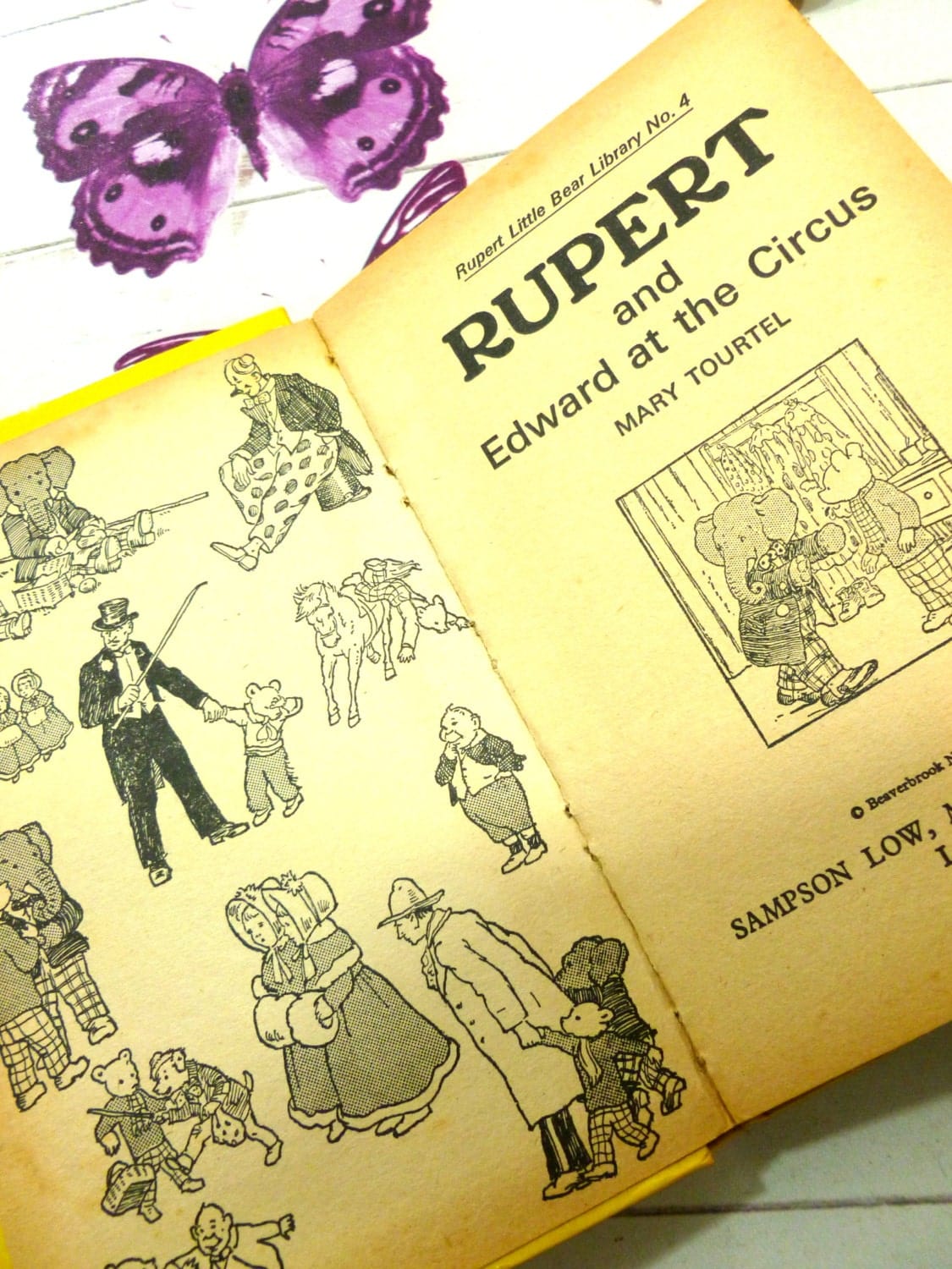 Black and white illustrated endpapers of vintage book Rupert and Edward at the Circus Mary Tourtel Little Bear Library number 4 1970s first edition showing Rupert and Edward the Elephant and other Rupert the Bear Characters. 