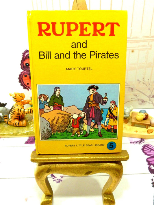 Front cover of yellow book showing Rupert Bill and the Pirates Mary Tourtel Little Bear Library number 5 1970s Vintage Hardback Rupert Book 1st Ed 