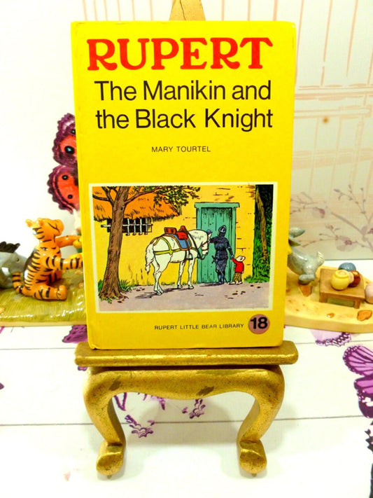 Yellow book showing picture of Rupert The Manikin and the Black Knight Mary Tourtel Little Bear Library number 18 1970s Vintage Hardback Rupert Book 1st Ed