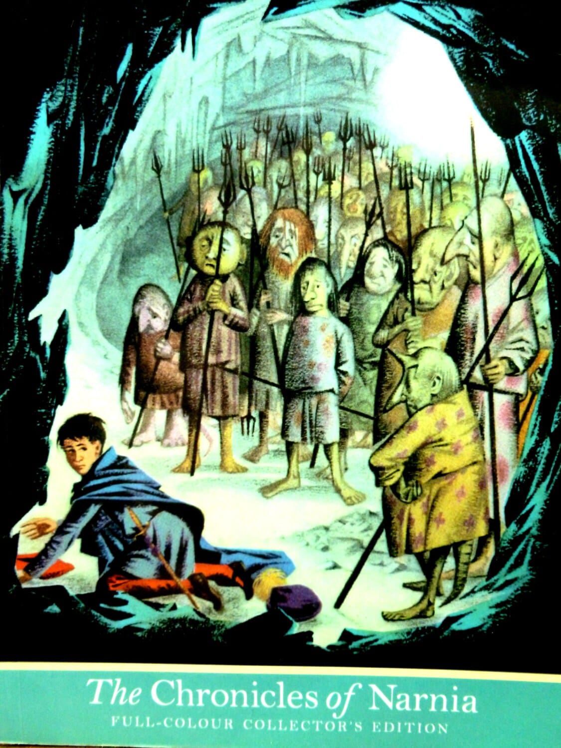 Front Cover of 'The Silver Chair' vintage children's book showing Eustace in cave underground surrounded by strange creatures. 