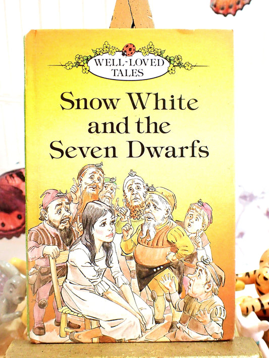 Front cover of vintage book showing Snow White and the Seven Dwarfs Vintage LadyBird Book Well Loved Tales Matt Cover 1980