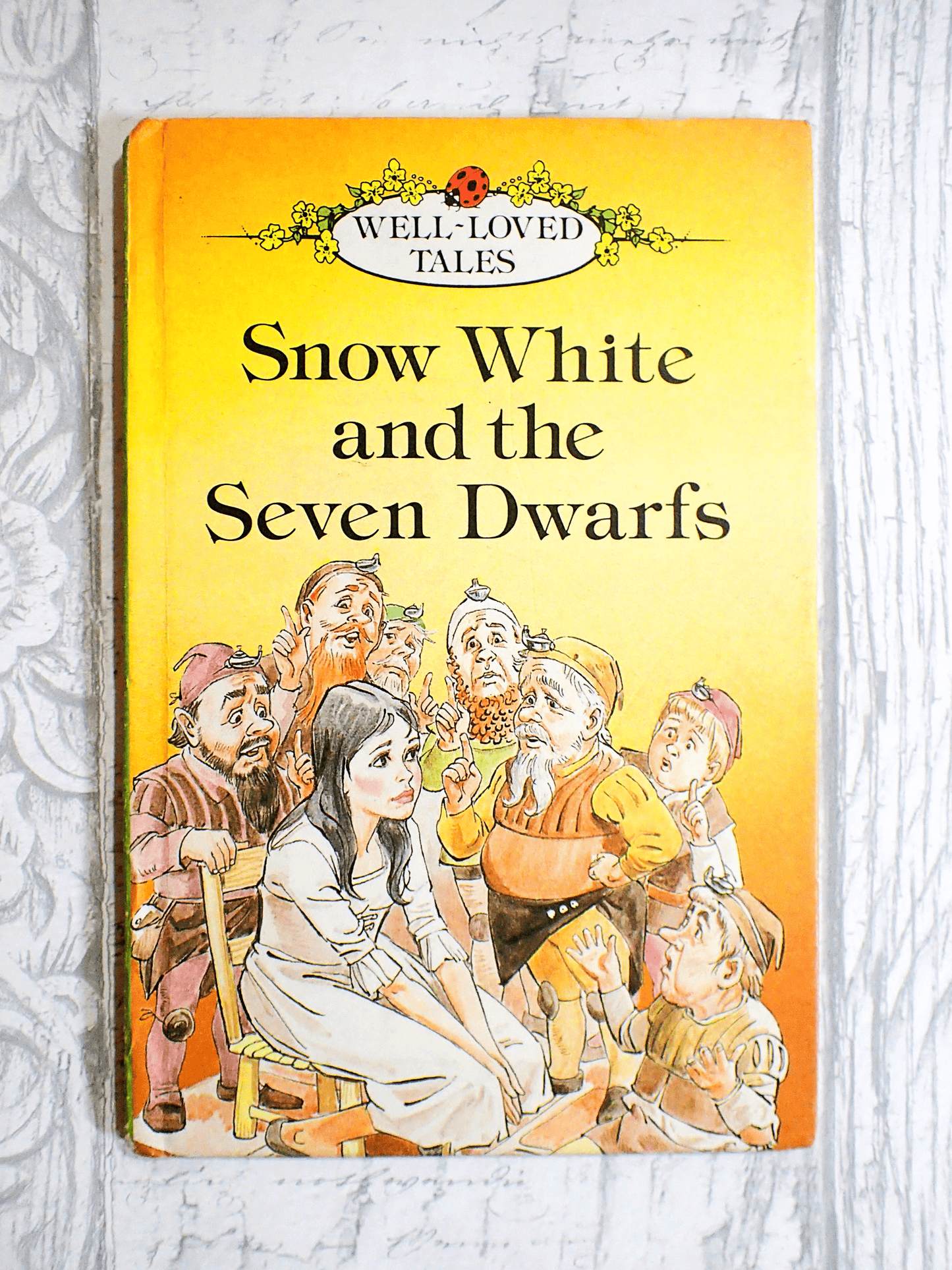 Vintage Ladybird Book Snow White against pale grey background.
