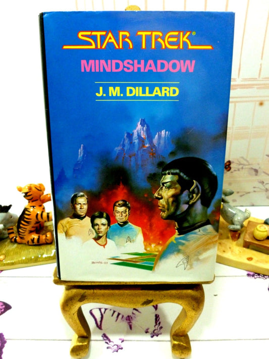 Front cover of Star Trek Mindshadow Spock 1st Ed 1st Printing Star Trek Novel Hardback with Dust Jacket 1987 showing Spock and Enterprise crew. 