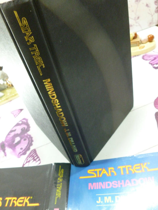 Black cloth covered boards and gilt titles of Star Trek Mindshadow Spock 1st Ed 1st Printing Star Trek Novel Hardback with Dust Jacket 1987.
