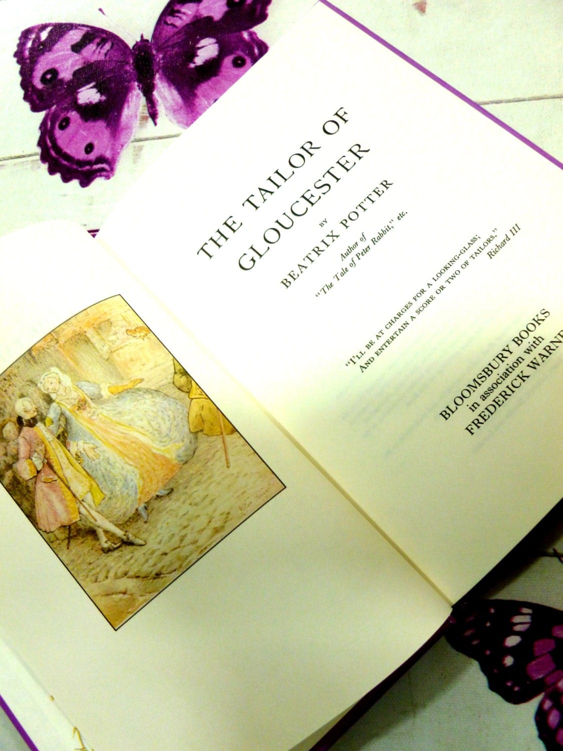 Title page and frontispiece of The Tailor of Gloucester First Edition Purple Bloomsbury Book 1993 Beatrix Potter Childrens Story showing a lady and gentleman in Georgian garb.