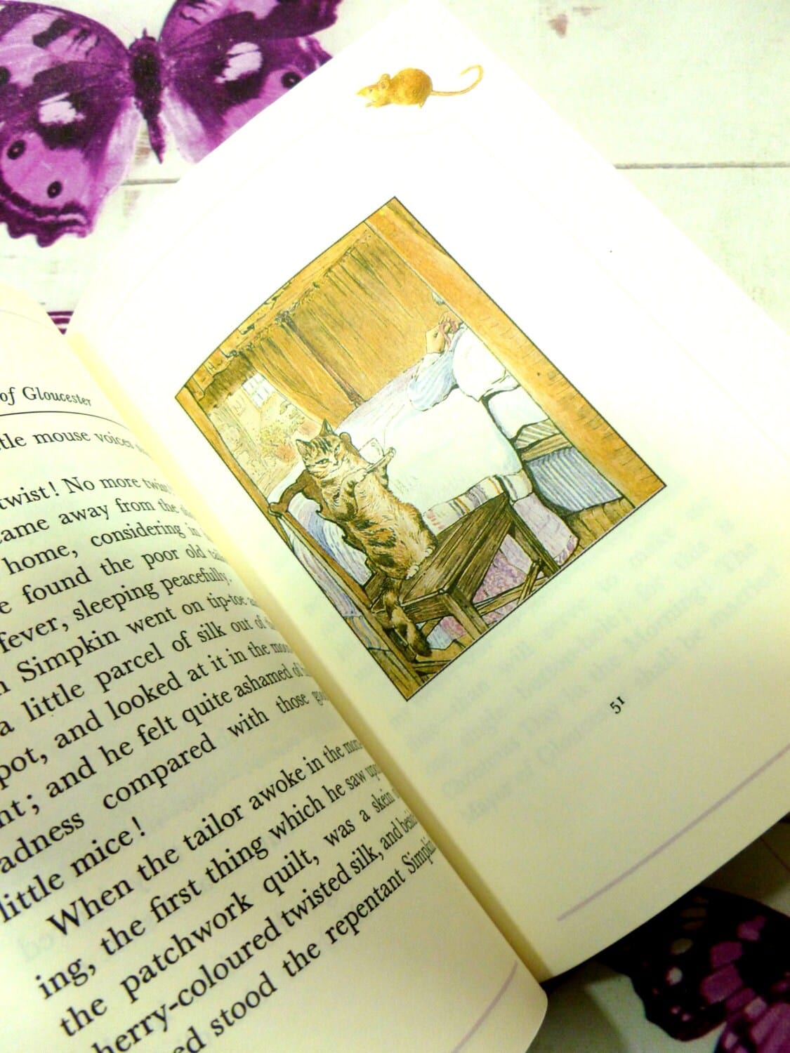 Page of The Tailor of Gloucester First Edition Purple Bloomsbury Book 1993 Beatrix Potter Childrens Story showing the cat Simpkin. 