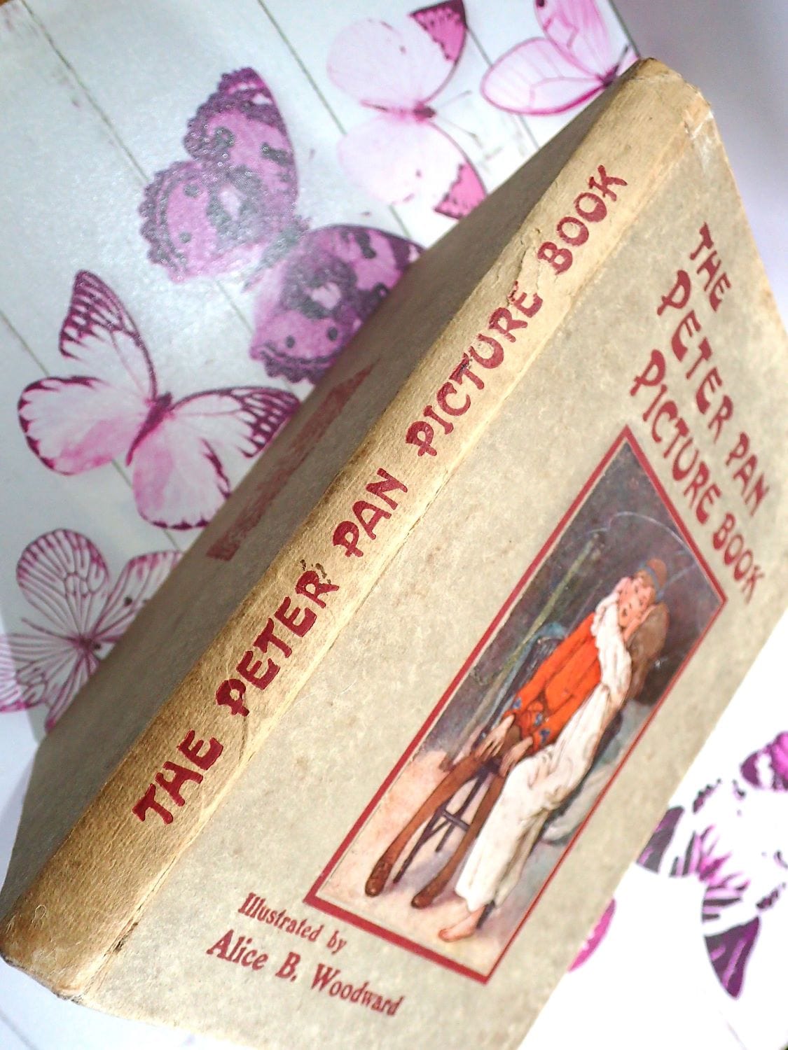 Titles on the spine of Antique Children's book by J.M. Barrie The Peter Pan Picture book