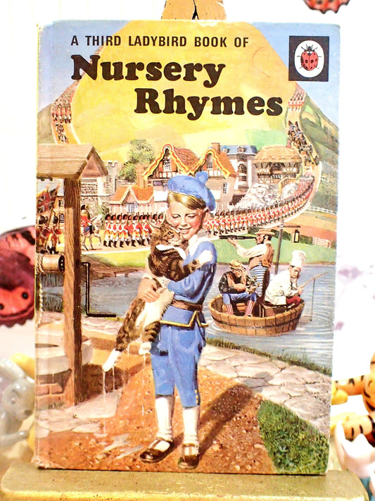 A third ladybird book of nursery rhymes old fashioned boy holding cat with three men in a tub