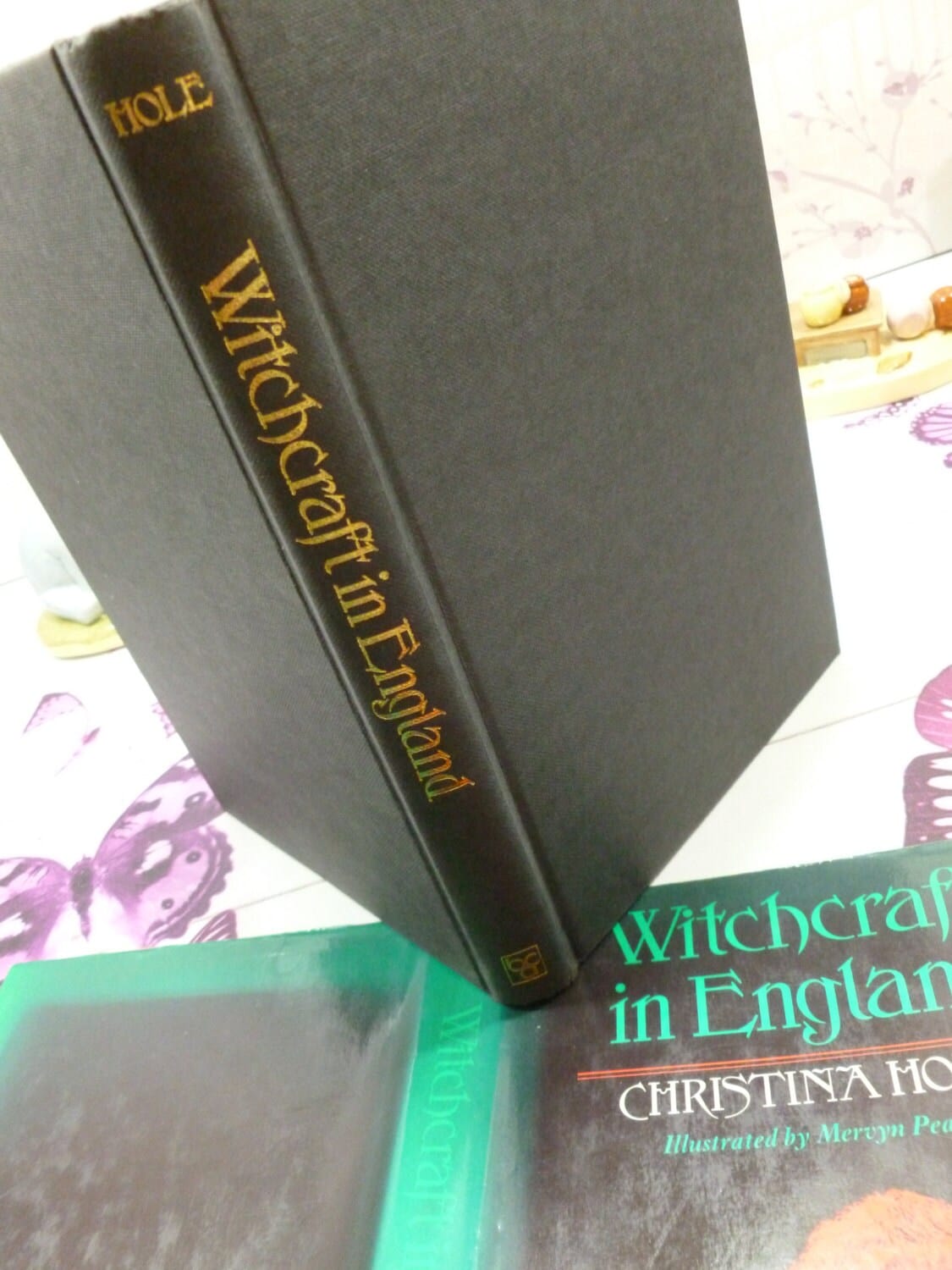 Black cloth covered boards with gilt titles of Vintage Witches Book Witchcraft in England Christina Hole 1st Ed. 1977.